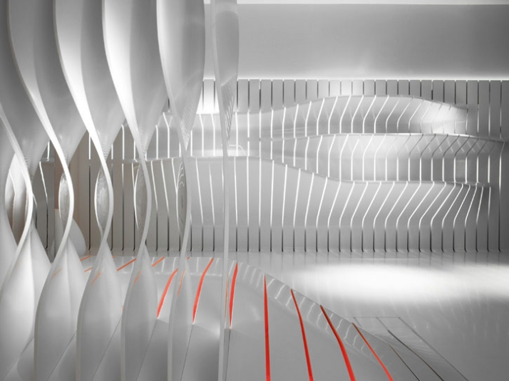 the kitchen area// conceptual kitchen area emerges gracefully from a backdrop of strips  // photo © Leo Torri 