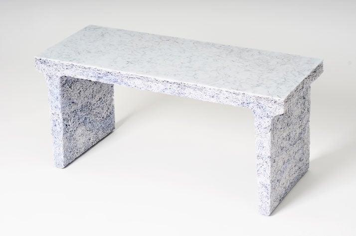 The Shredded Collection Bench (White Edition) is made from 3 kg shredded confidential documents and white pigmented resin. The top and shelves have be