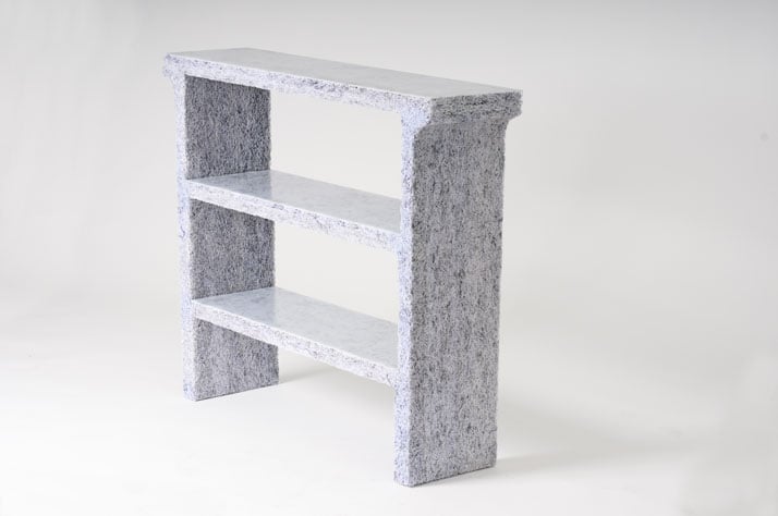 The Shredded Collection Console (White Edition) is made from 5 kg shredded confidential documents and white pigmented resin. The top and shelves have 