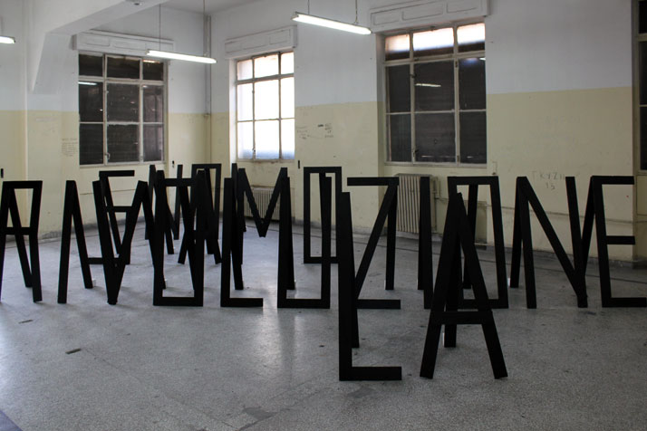 3rd Athens Biennale 2011 MONODROMEKostas Bassanos, La Rivoluzione Siamo Noi, (2010)Pallet wood, ink, plaster600x500 cm(Installation view)Courtesy of t