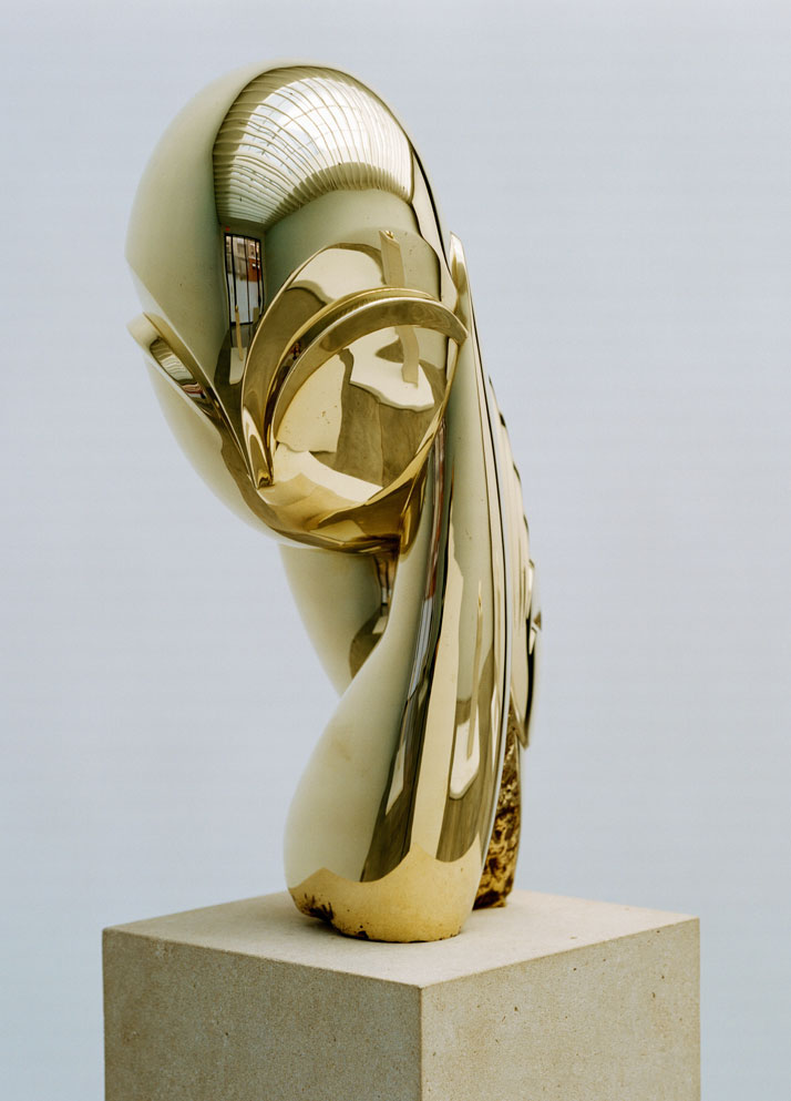 Constantin Brancusi, Mademoiselle Pogany II, 1925-2006, polished bronze, Sculpture: 16 7/8 x 7 x 11 3/4 inches, Overall: 27 x 10 x 8 3/4 inches, edition of 8. Photography by Francois Halard/© Artists Rights Society (ARS) New York/ADAGP, Paris. / Courtesy of the Brancusi Estate and Paul Kasmin Gallery.{Mademoiselle Pogany II (1925), stands at 11.7 inches tall, in an edition of 8. The plaster model of the first version debuted at the Armory Show in 1913. The series of Mademoiselle Pogany was his most photographed work. Today this polished bronze version of Mademoiselle Pogany II still embodies the inexpressible nature of the feminine spirit.}