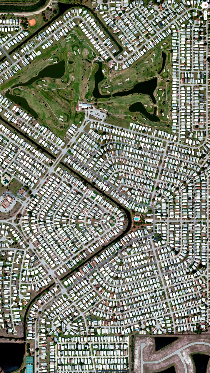 Barefoot Bay Development, Brevard County, Florida, USA.Overview captured with Apple Maps. Satellite imagery from Digital Globe.Copyright 2014, Daily Overview.