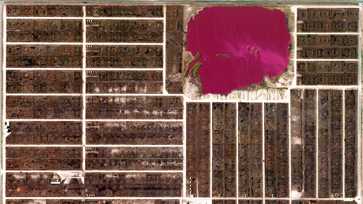 Cattle feedlots and waste lagoon, Summerfield, Texas, USA.Overview captured with Apple Maps. Satellite imagery from Digital Globe.Copyright 2014, Daily Overview.