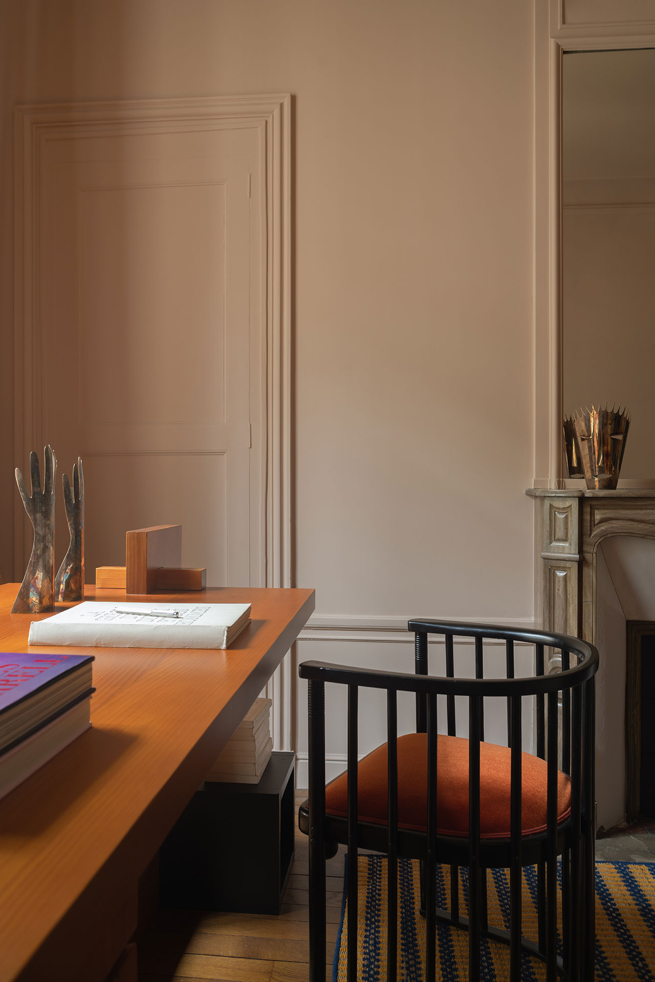 Photography by Giulio Ghirardi.
Featured: Desk from Galerie Béton Brut; Lacquered metal lamp by Gino Sarfatti for Arteluce (Galerie Romain Morandi); 'Mains' sculpture by Gio Ponti for Christofle; Armchair in steambent and lacquered beech and velvet upholstery by Josef Hoffmann for J. &amp; J. Kohn (Galerie Romain Morandi); 'Carmina' carpet by Casa Lopez.
