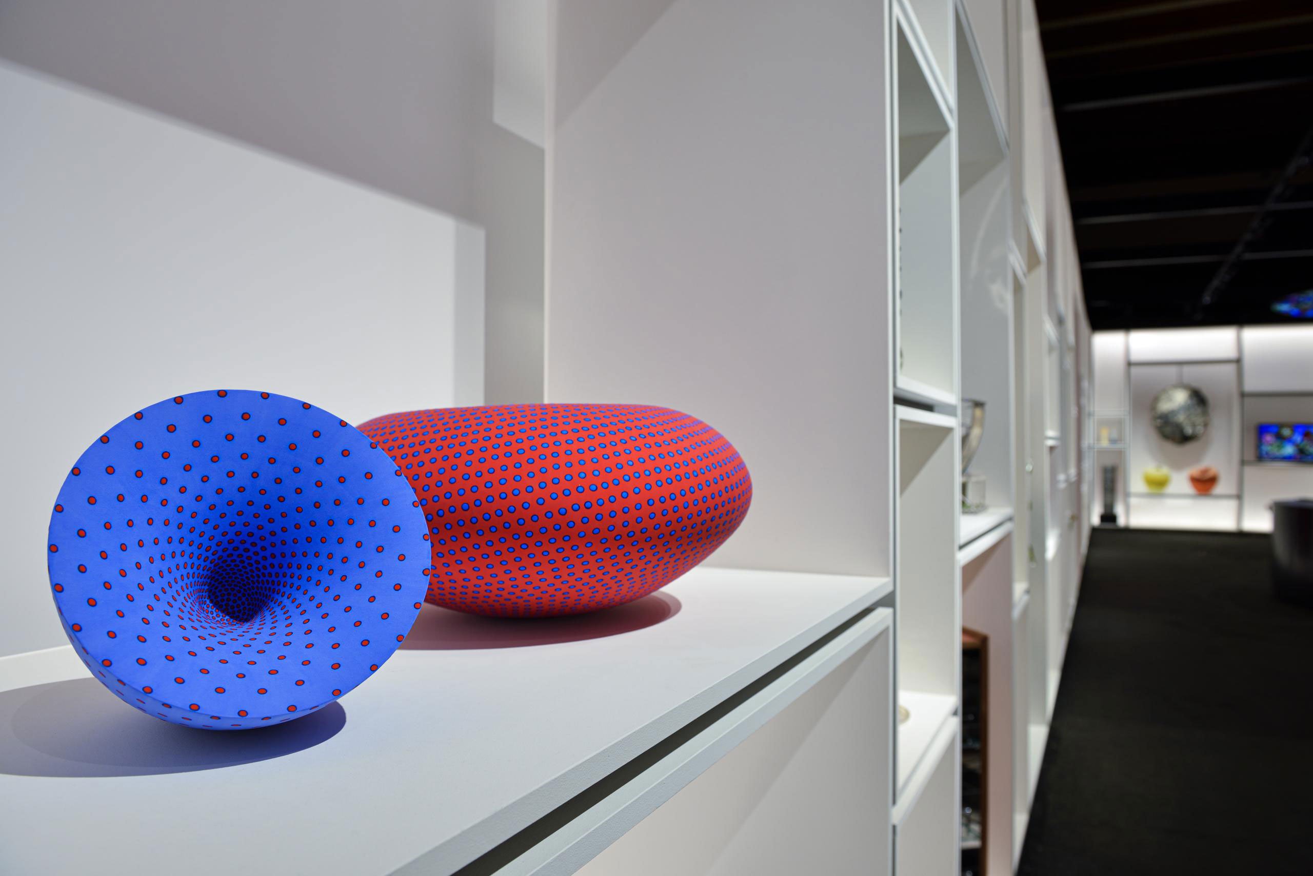 Red Bindu Form (2022) &amp; Vortex (2022) by Grainne Watts. "Next of Europe" installation at Homo Faber by Jean Blanchaert and Stefano Boeri. Photography by Lola Moser © Michelangelo Foundation.