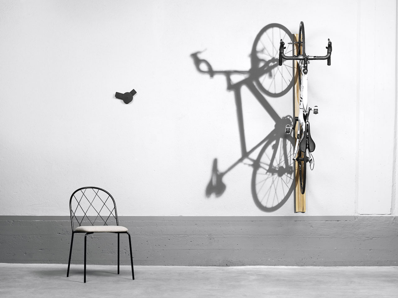 Mesh chair by Lars Hofsjö, O´clock  wall clock by Louise Hederström and Giro wall-mounted cycle rack by Mattias Stenberg for David Design.