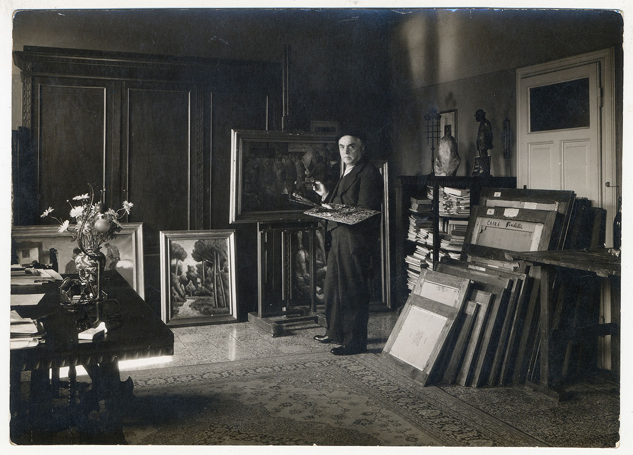 Carlo Carrà in his Milanese studio (via Pascoli 18), 1934. Archive Carlo Carrà © Carlo Carrà by SIAE 2018.