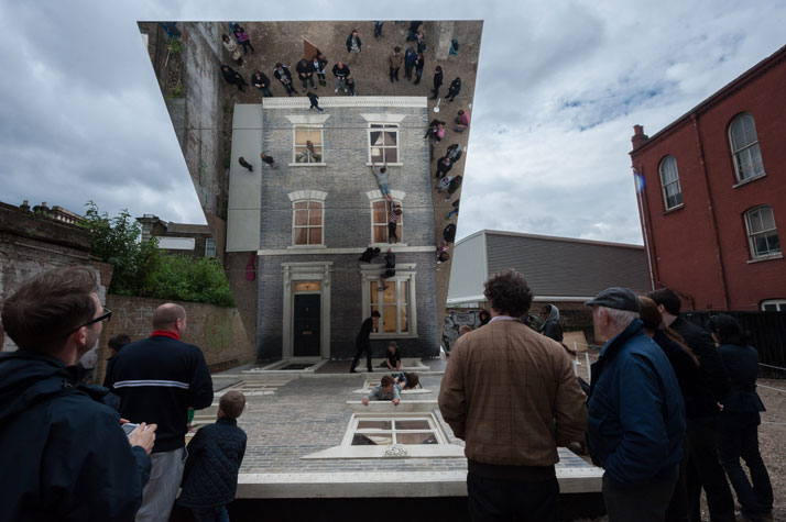 Visitors watch from outside the houseLeandro Erlich: Dalston HouseInstallation images© Gar Powell-Evans 2013 Courtesy of Barbican Art Gallery
