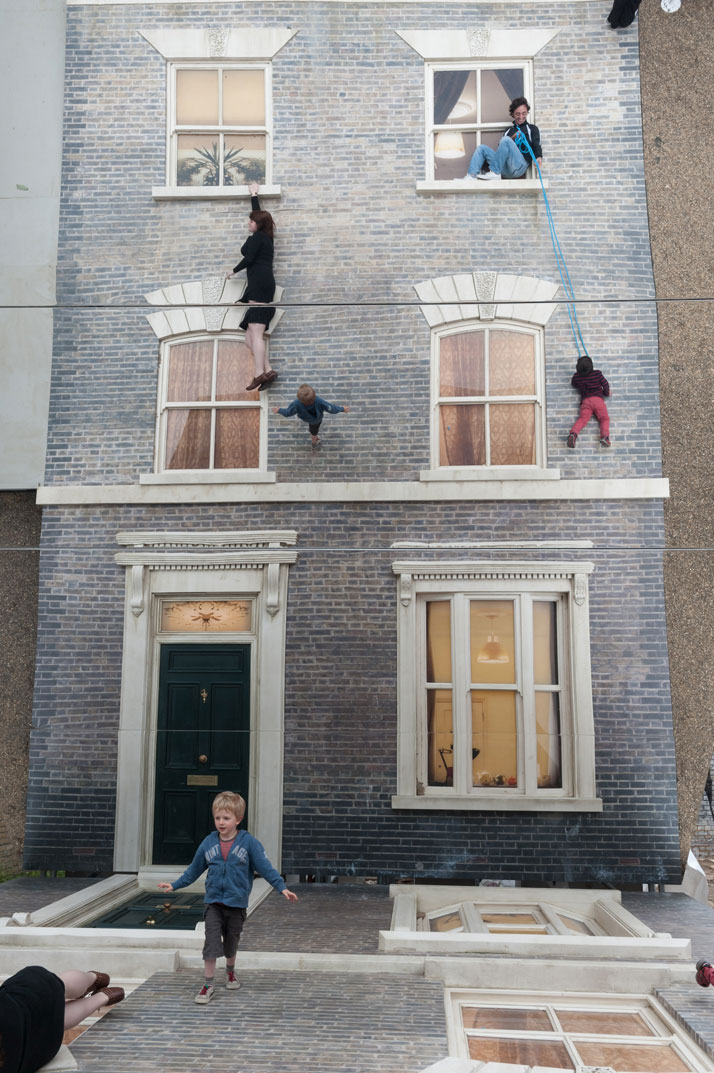 Visitors play with illusionLeandro Erlich: Dalston HouseInstallation images© Gar Powell-Evans 2013 Courtesy of Barbican Art Gallery