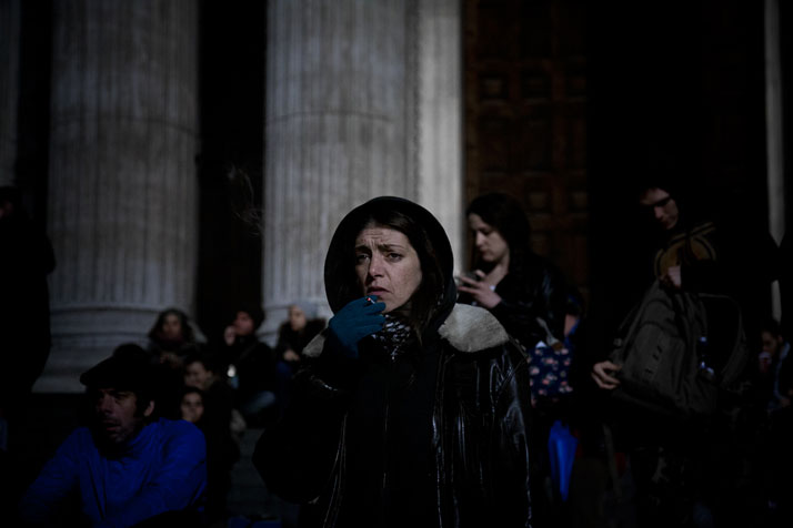 October 2011 // Occupy London: a woman smokes a cigarette at the steps to St Paul’s Cathedral.photo © Brian Leli
