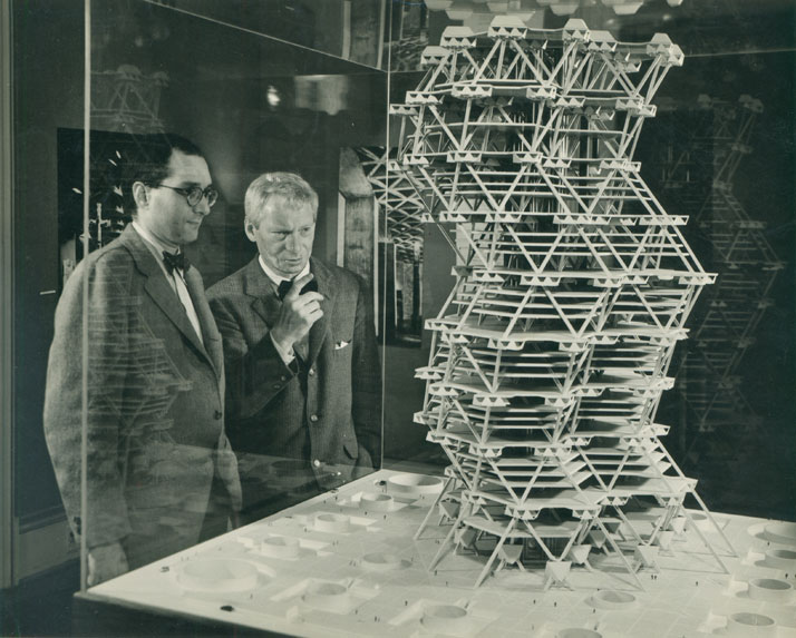 Louis  Kahn in front of a model of the City Tower Project in an exhibition at  Cornell University, Ithaca, New York, February 1958.© Sue Ann Kahn.