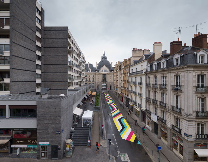 Lang-Baumann, Street Painting #7, 2013, 59 x 3,8 m, road marking paint. Rennes (France). Produced by 40mcube and PHAKT, in partnership with Signature and Identic, and with the support of the City of Rennes and the Swiss Art Concil Pro Hevetia. Courtesy Loevenbruck gallery and Urs Meile gallery. Photo : Lang-Baumann.