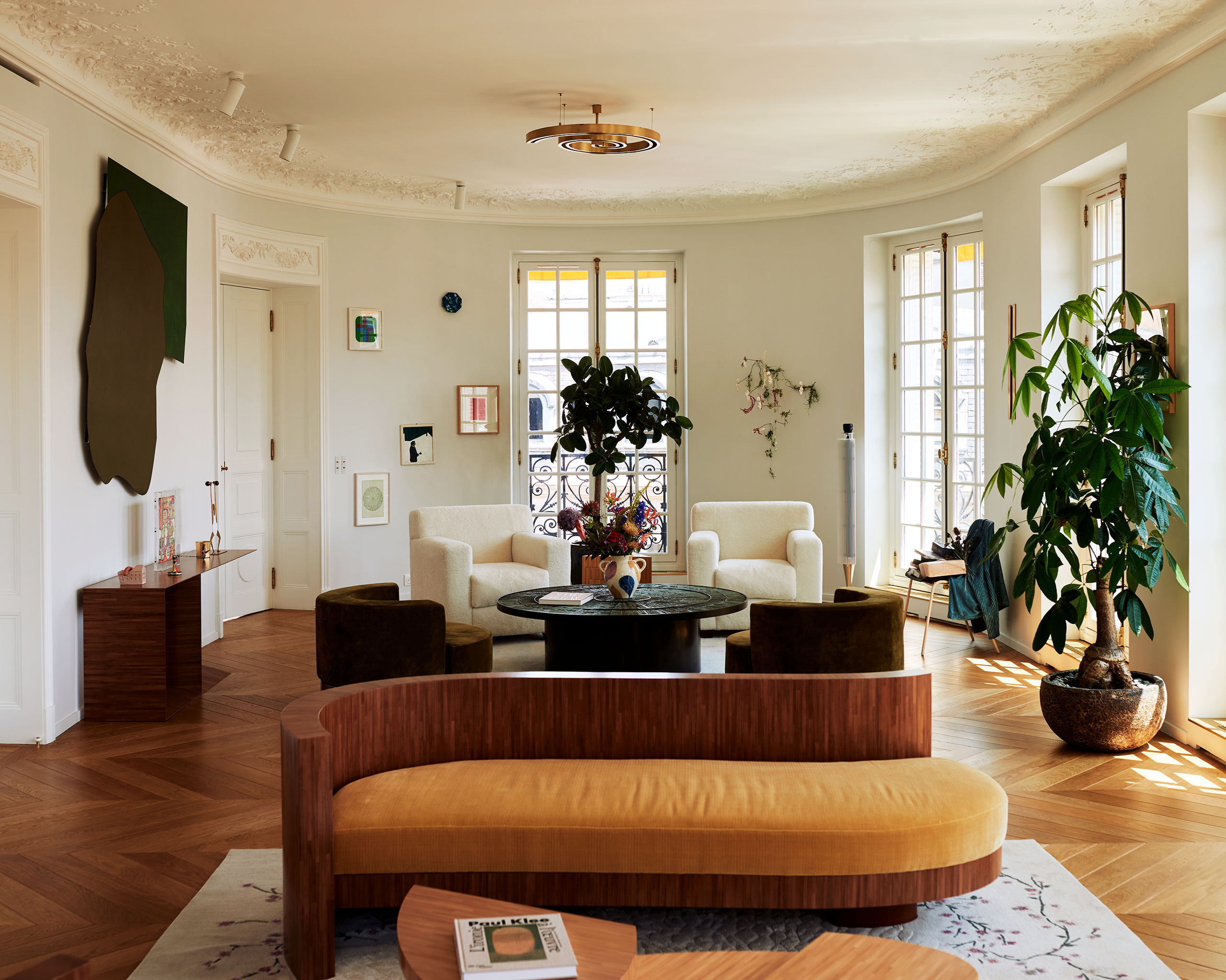 Sofa (foreground) and console (left) by Richard Peduzzi; Artwork above console by Imi Knobel; Vintage round armchairs; White armchairs by Jean-Michel Franck; Sculpture on wall by Bianca Bondi; Chair sculpture (right) by Tatjana Trouvé from Guardian series.
Photography by Francois Coquerel.