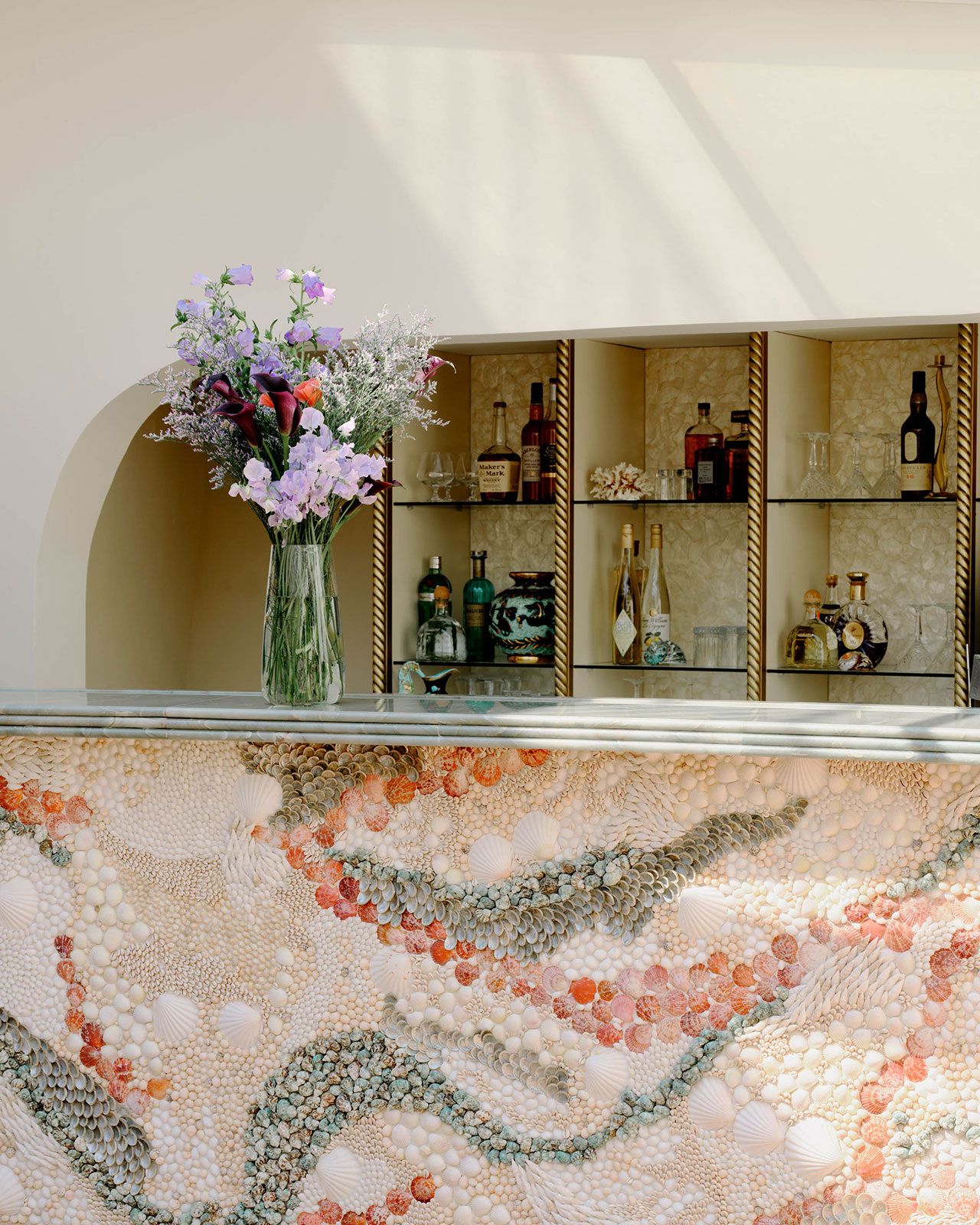 Seashell-adorned bar counter by Caroline Perrin. Photography by Christophe Coenon.