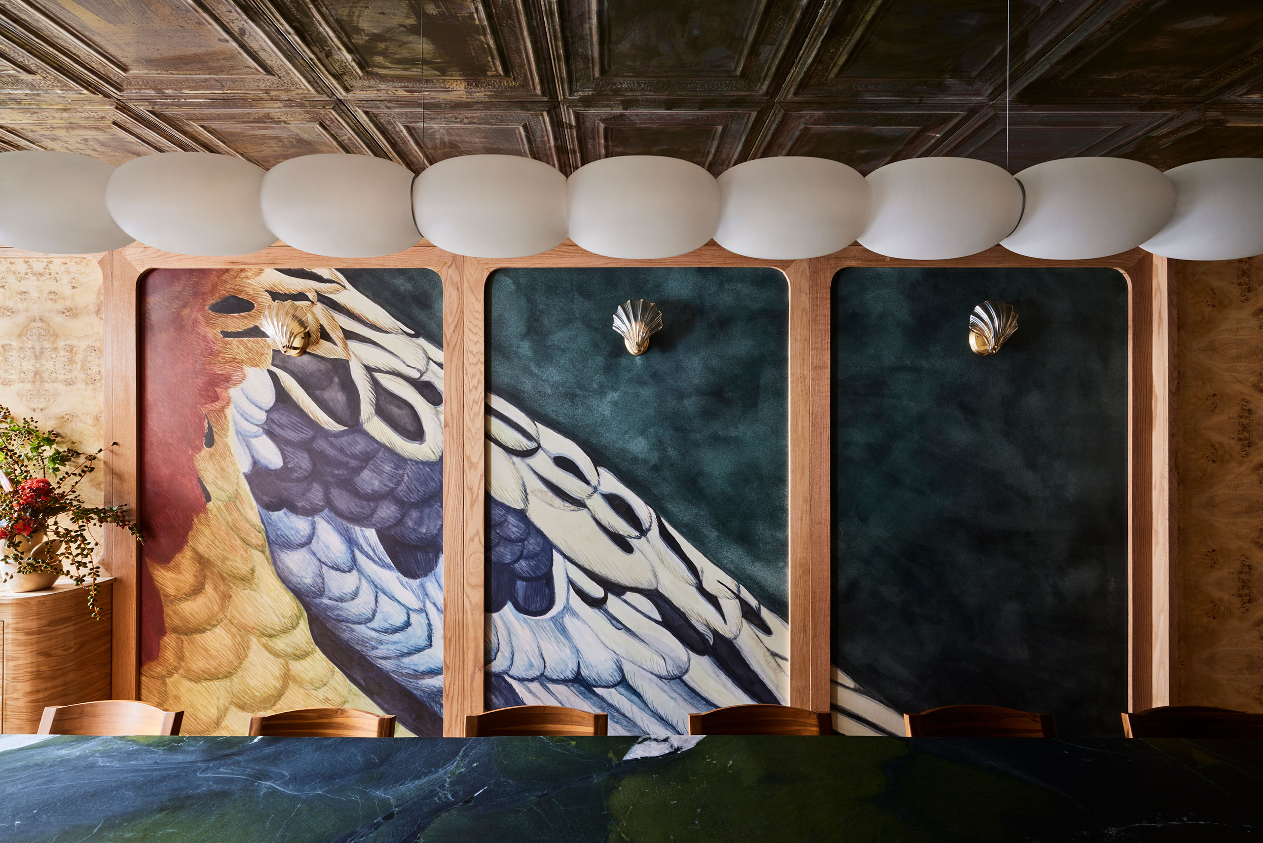 Wallpaper mural created by Polonsky &amp; Friends based on watercolour painting by Hollie Kelley; Light pendant by Pablo Bolumar.
Photography by Nicole Franzen.