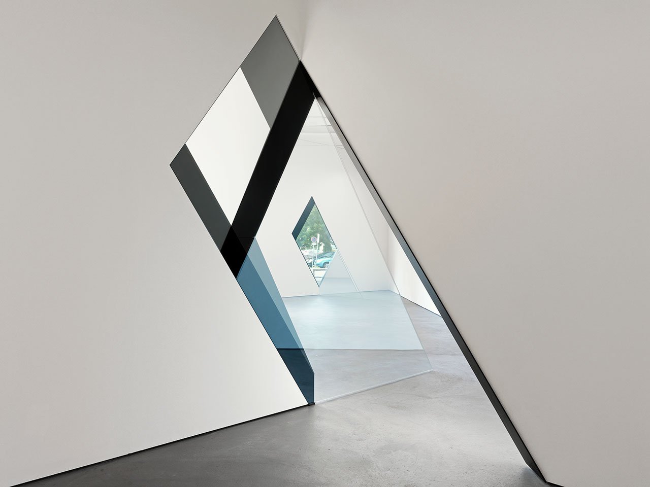 SARAH OPPENHEIMER, 33-D, 2014.Aluminum, glass and existing architecture. Total dimensions variable.Location: Kunsthaus Baselland.Photo credit: Serge Hasenböhler.