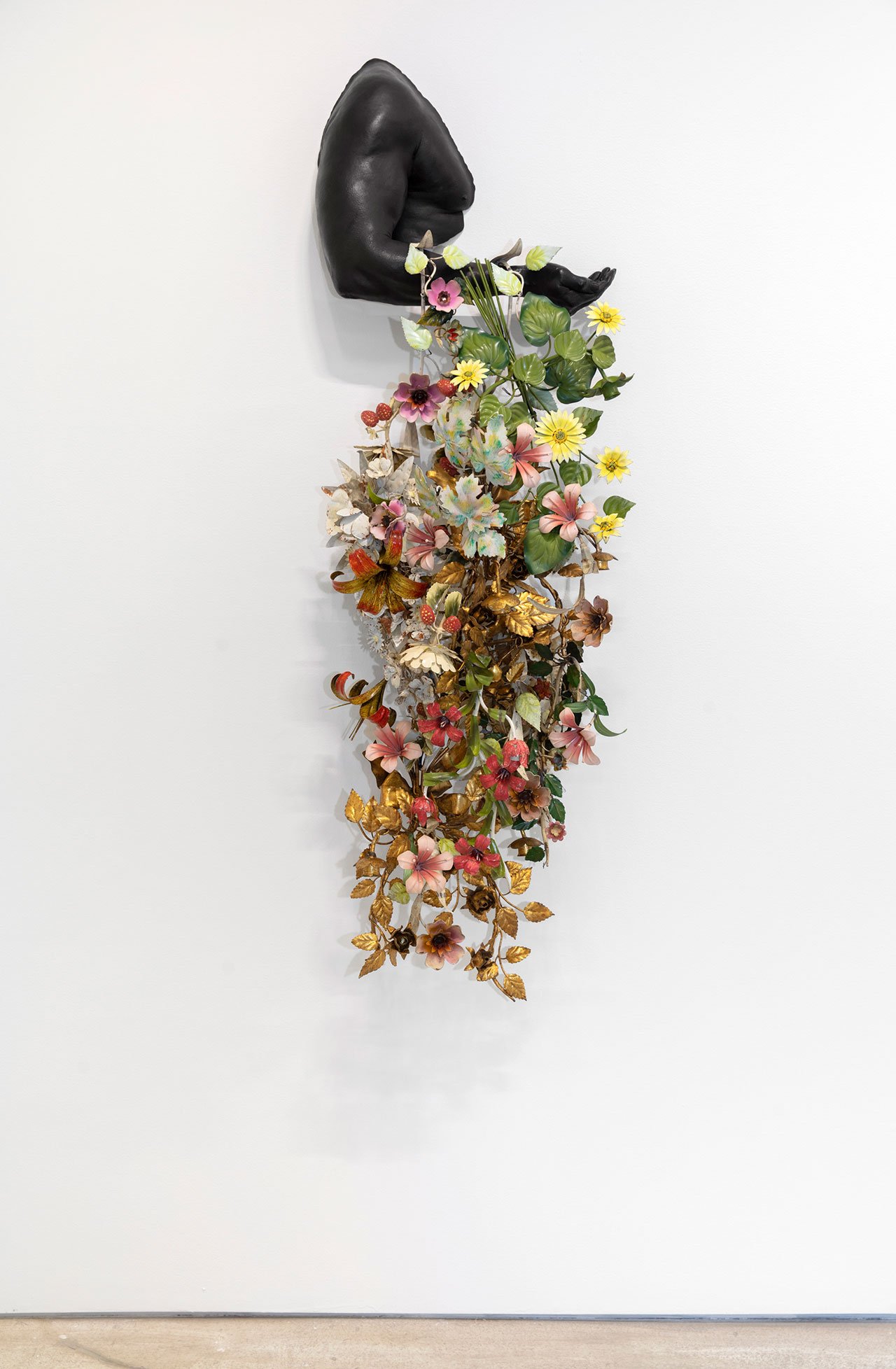Nick Cave, Arm Peace, 2018. Cast bronze and vintage tole flowers. 57 1/2 x 19 3/8 x 13 1/2 in. © Nick Cave. Courtesy of the artist and Jack Shainman Gallery, New York.