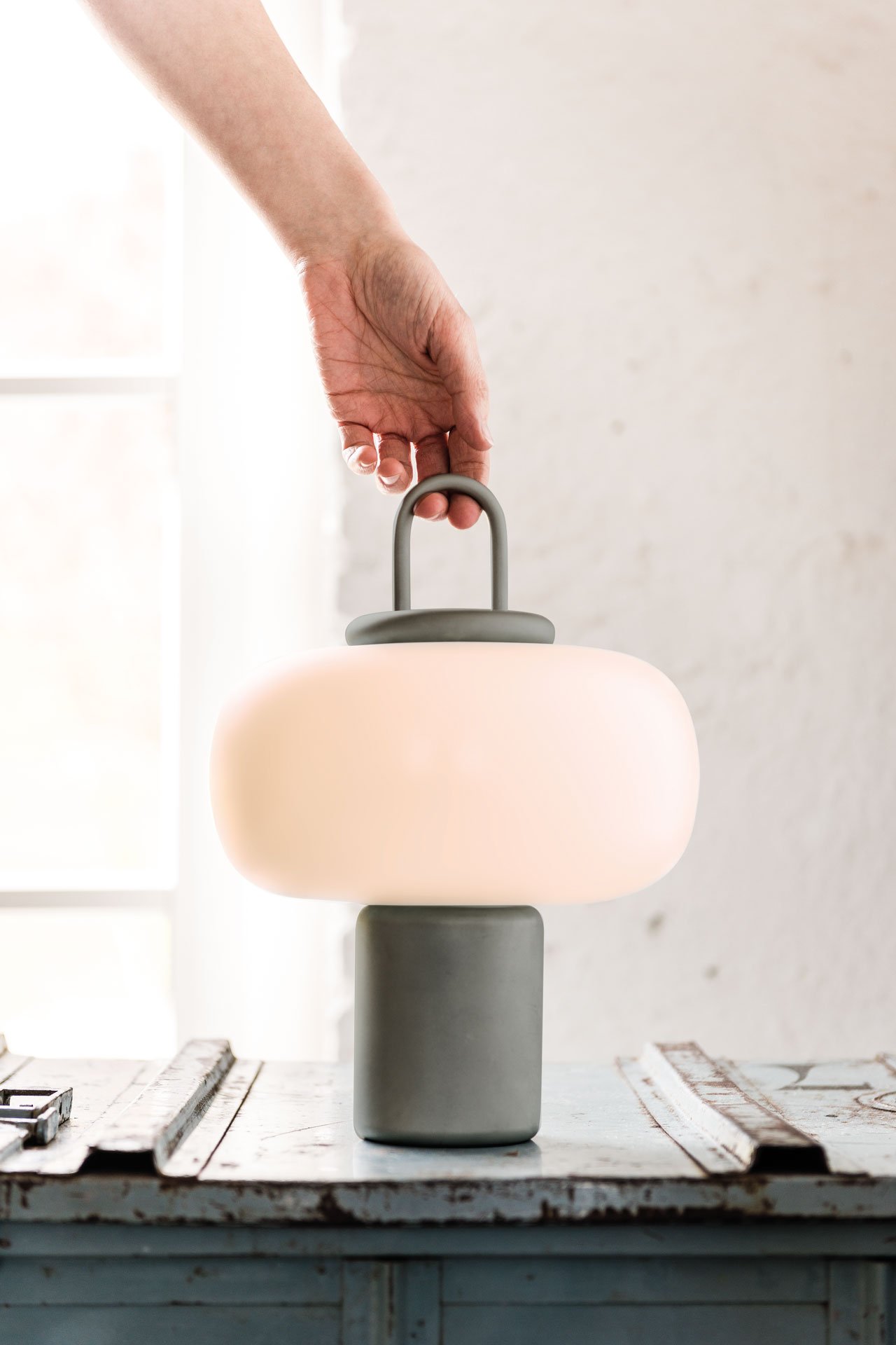 Nox portable luminaire with wireless charging system designed by Swiss-Argentinian product designer Alfredo Häberli for Astep.