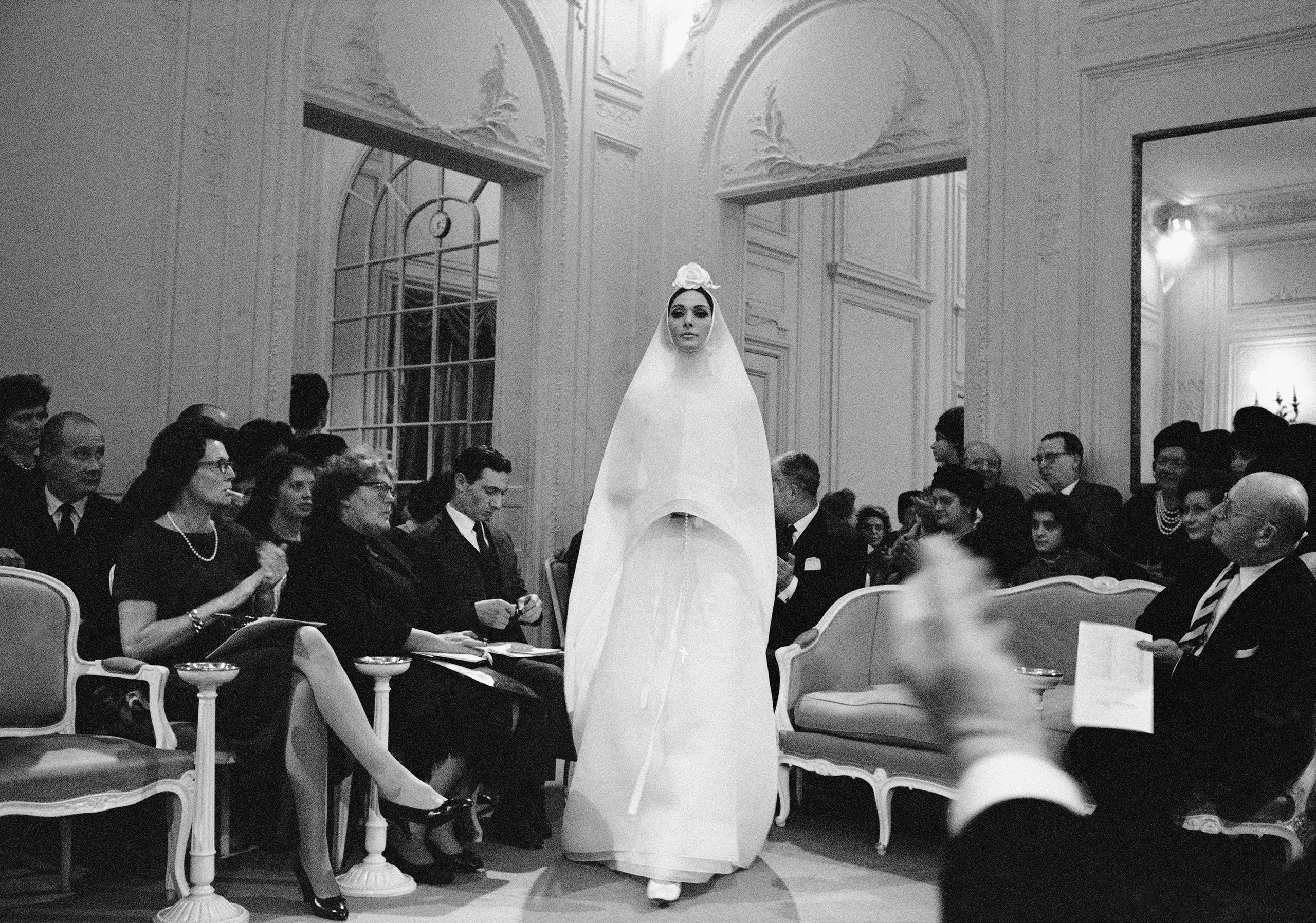 Kouka modeling Bohan’s wedding dress in Dior’s Grand Salon. In her opinion, ''the fashion house was temple-like,'' a world of good taste and general excellence.1961, Hyménée dress, Spring-Summer 1961 Haute Couture collection, Slim Look line.photo © Mark Shaw.