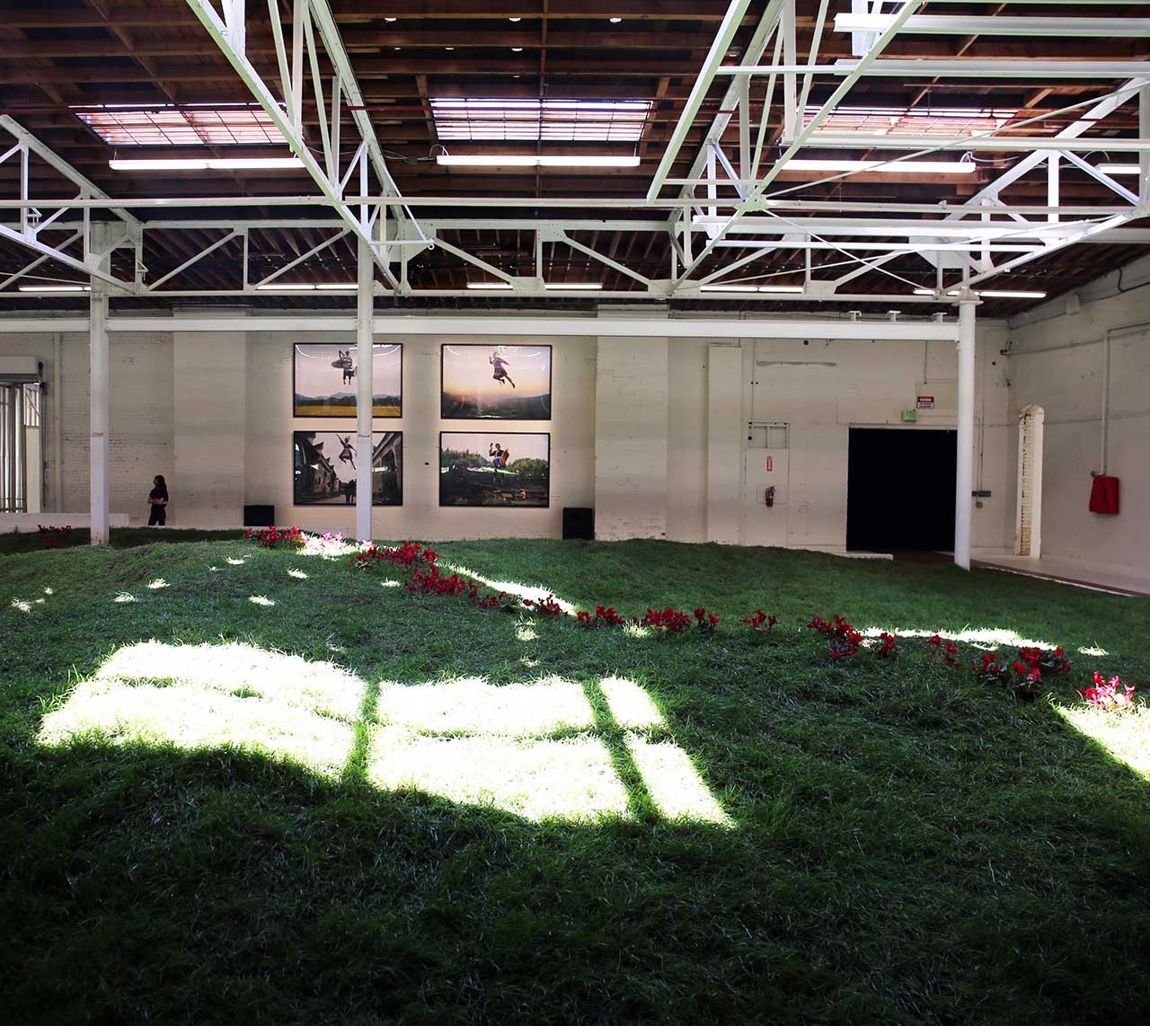 Simon Birch, Garlands, Lily Kwong and KplusK associates, 2016-17. Earth, grass, live flowers, steel, wood, swings. Installation view. Photo by Gloria Yu. 