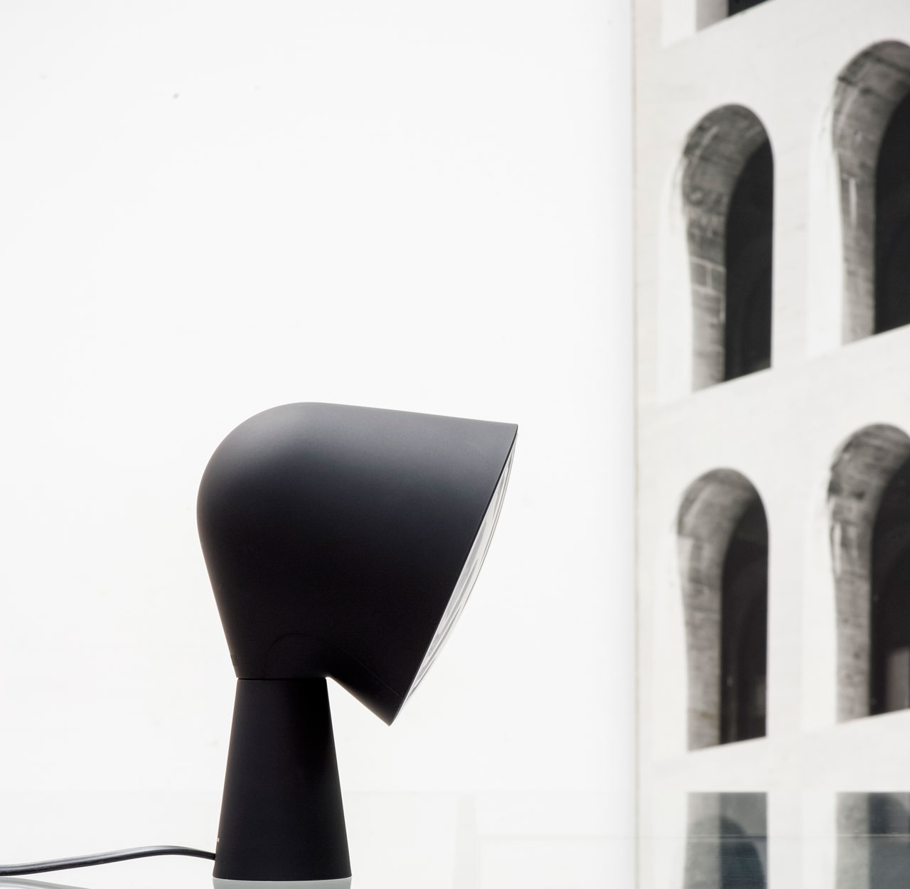 BLACK BINIC table lamp by Ionna Vautrin for FOSCARINI , limited edition for the 10 by Yatzer debut collection/ Batch-dyed polycarbonate and ABS / 14 cm W x 20 cm H, 14 cm depth / Edition of 100. Styling by Costas Voyatzis, photo by Fabrizio Annibali.