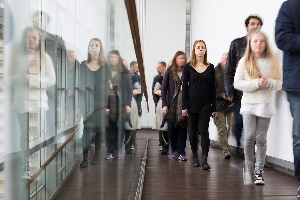 An AS ONE "facilitator" performing "slow walking" on the Benaki Museum ramp. Photo © Natalia Tsoukalas.