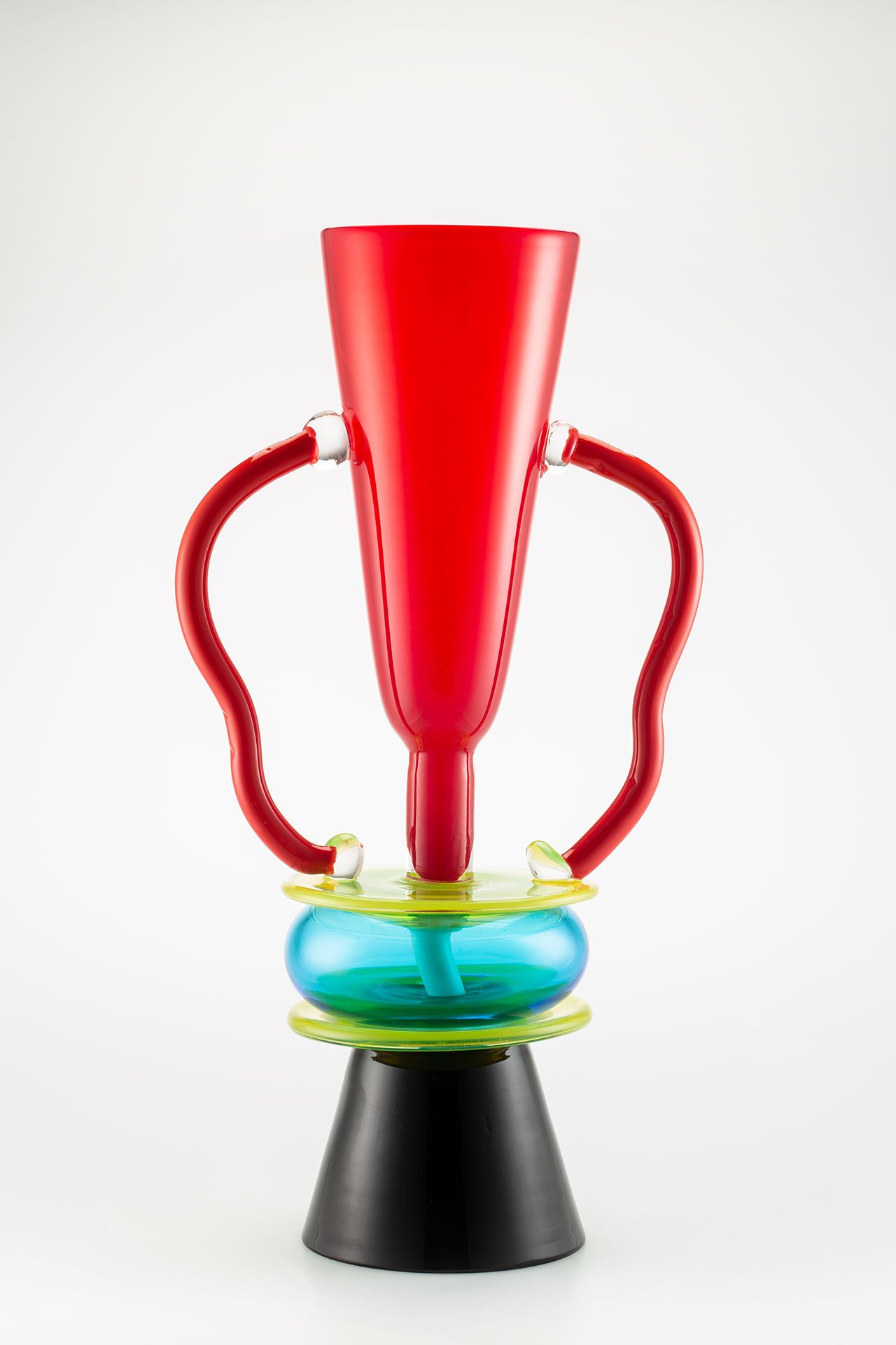 Sirio, design by Ettore Sottsass, Colorful, clear, hand-blown glass, colorless surface layer. Signed on the edge of the stand: "E. Sottsass per Memphis Milano”. Designed in 1982.  Signed on the base. Photo by Francesco Allegretto, courtesy Fondazione Berengo.