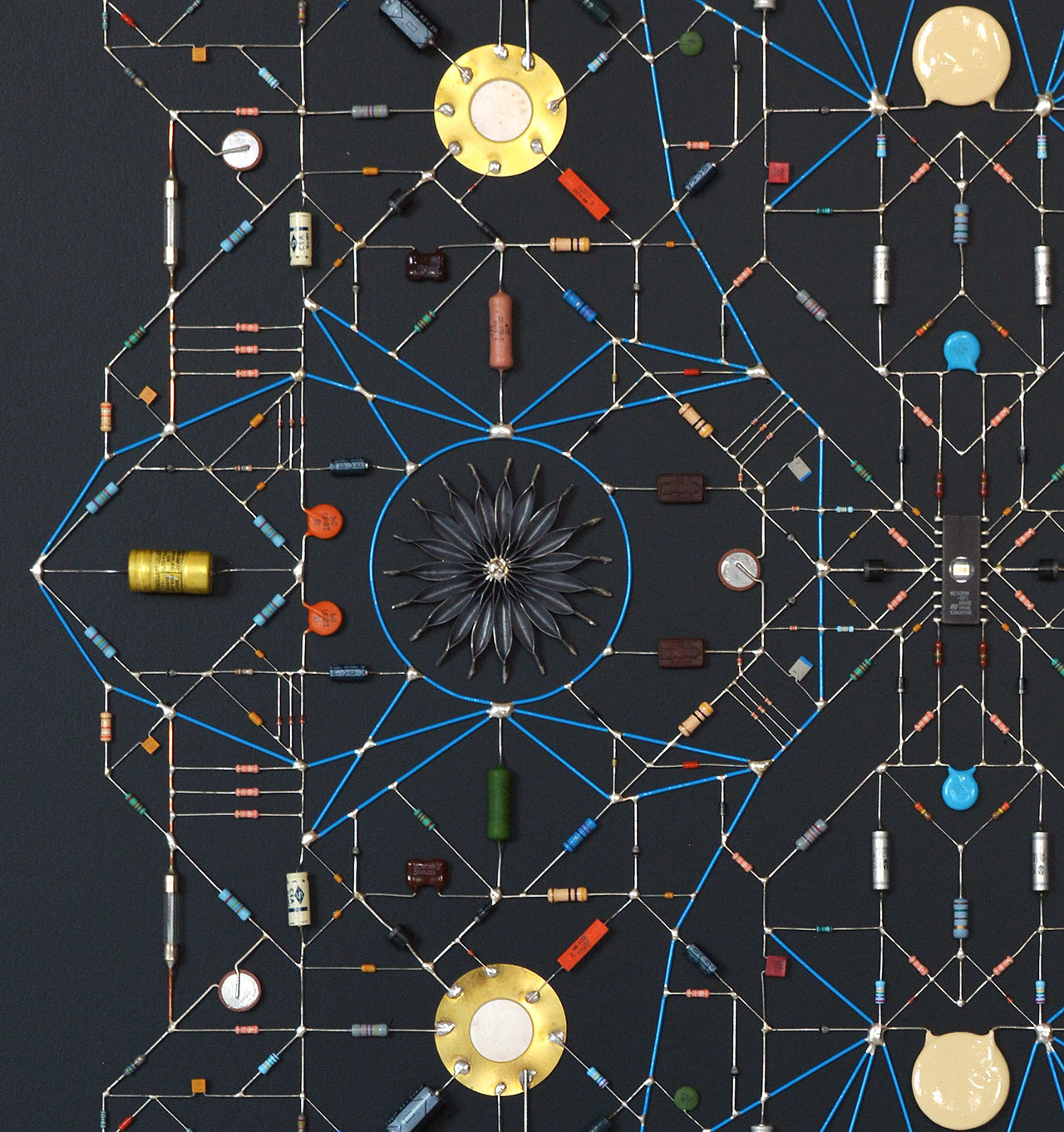 Technological Mandala 101 (close up), 2019. Electronic components, copper wires, varnish, lead, paper, acrylic paint, mdf, framed,  84x84x5,5 cm | 33x33x2¼  inches. Courtesy: The Flat – Massimo Carasi. Photo by The Flat.