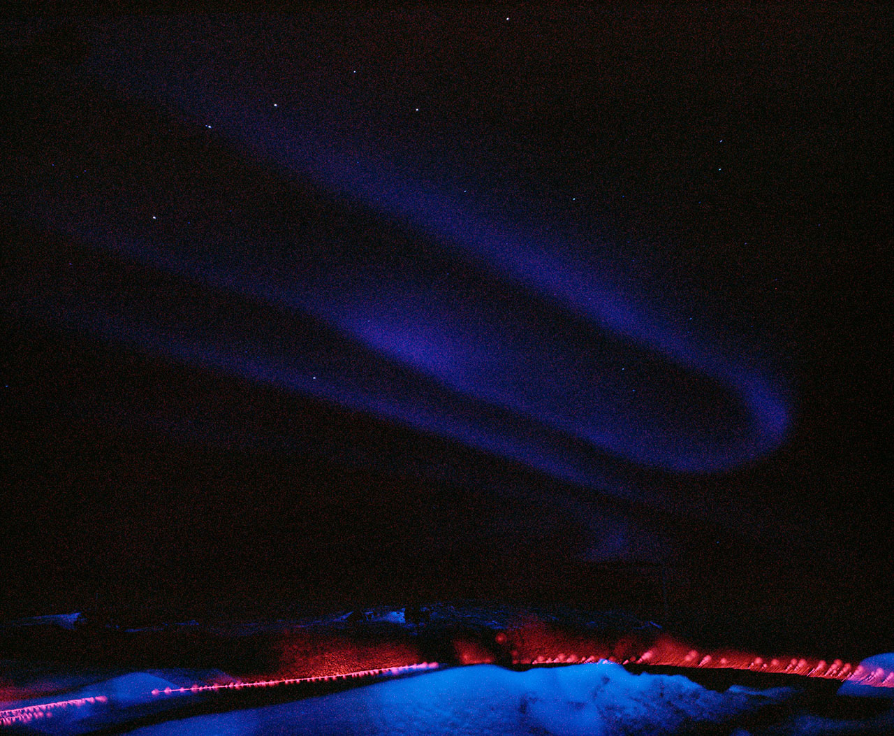 Edward Thompson, The Northern Lights and anomaly, 2016. Iceland. 120mm CIR Photograph. © Edward Thompson/Schilt Publishing &amp; Gallery.