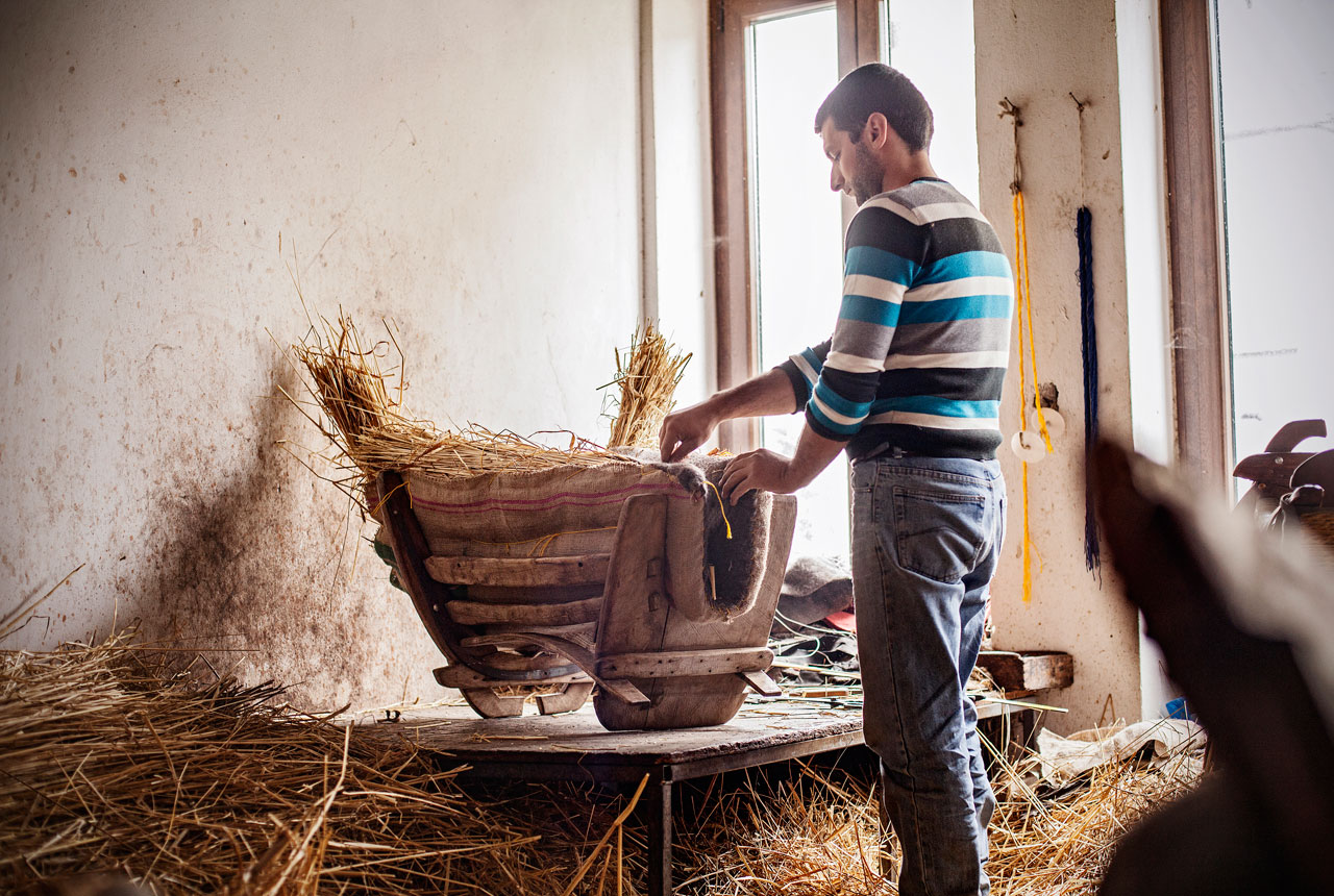 In the city of Volos. Pelions last traditional saddler works on a saddle for donkeys and mules. © Benjamin Tafel.