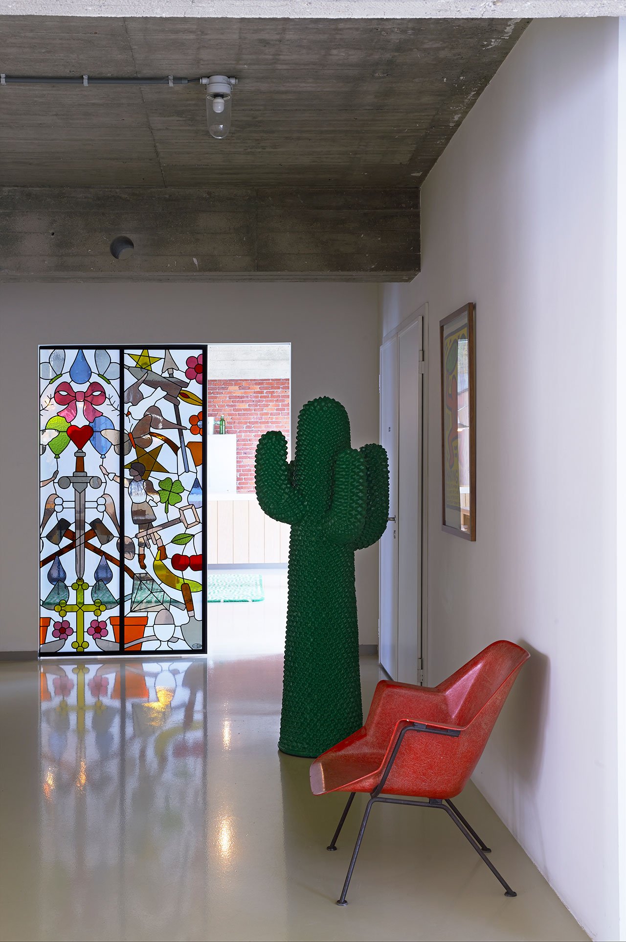 Hall. Stained Glass Sliding Doors, Studio Job. Cactus, Gufram. Chair, Wim Rietveld. Poster, Keith Haring. Photo by Dennis Brandsma.