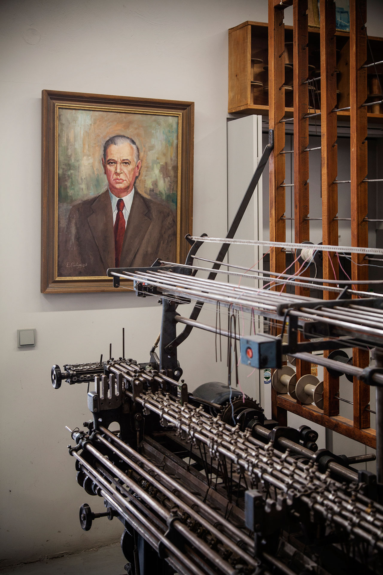 Athens. The Mentis ribbon weaving company. In the background a portrait of one of the former owners. © Benjamin Tafel.